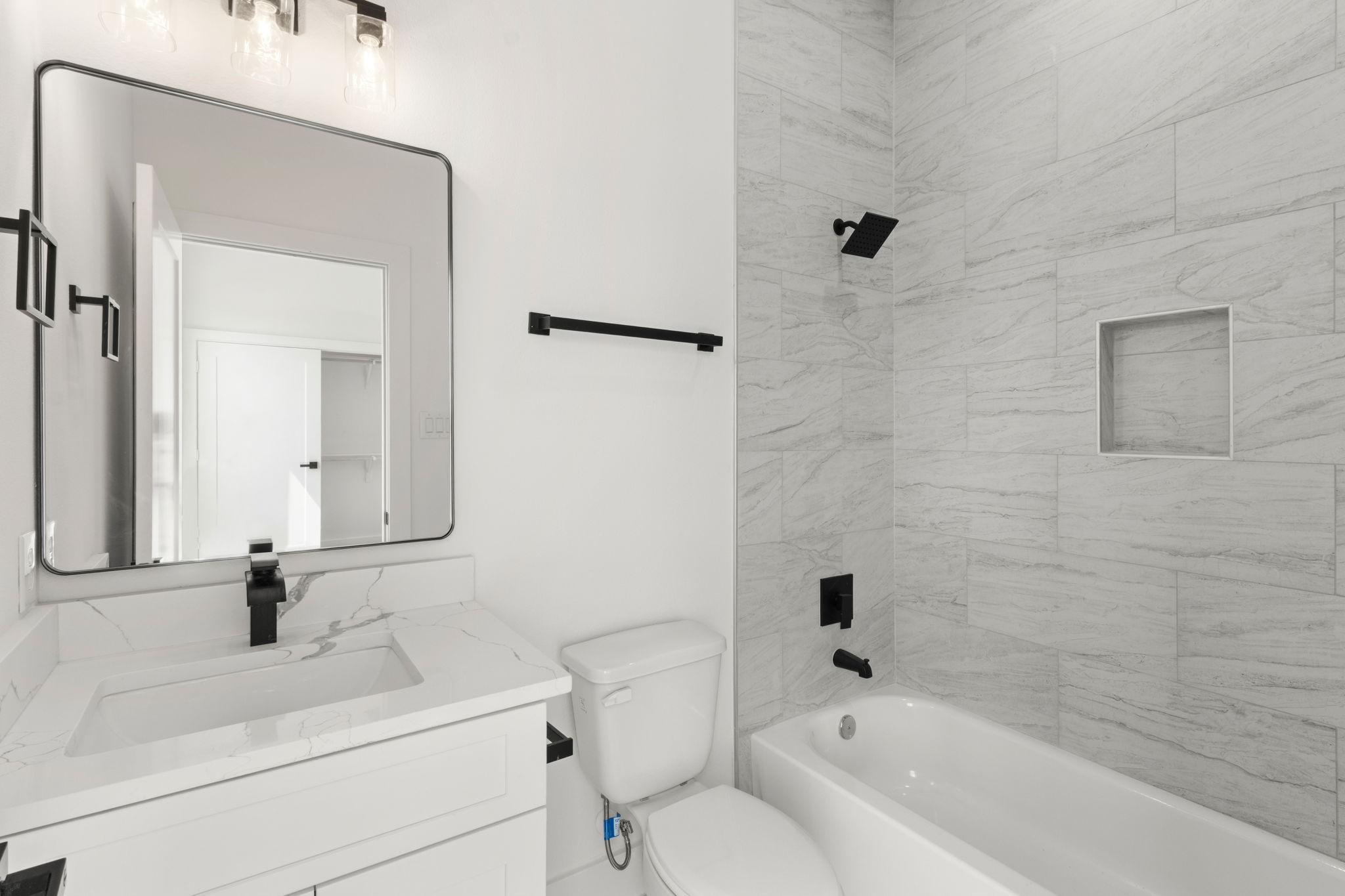 5512 Hardy Street Houston, TX 77009 - Photo 32 of 39 a bathroom with a sink a toilet and shower