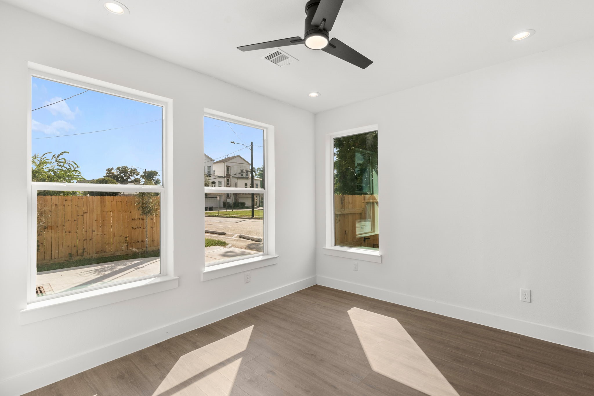 5512 Hardy Street Houston, TX 77009 - Photo 34 of 39 a view of an empty room with a window and wooden floor