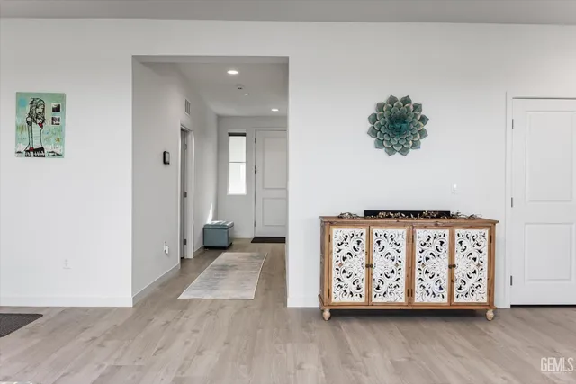 an entryway with wooden floor