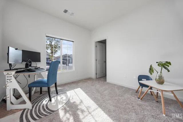 a workspace with furniture and a window