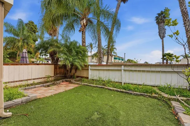 a view of backyard with a garden and plants