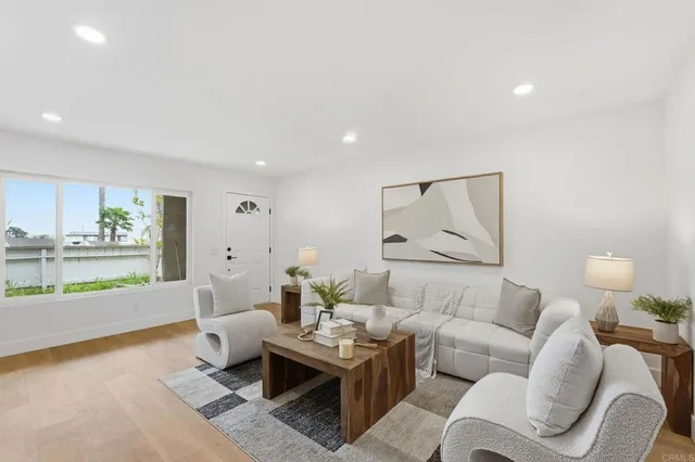 a living room with furniture and a lamp