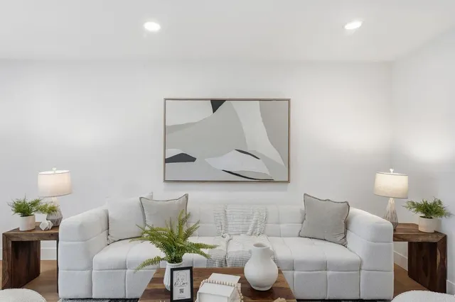 a kitchen with stainless steel appliances white cabinets and a sink