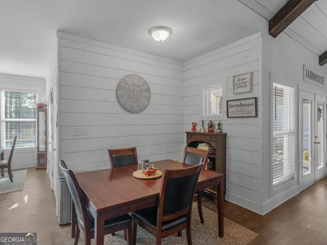 a living room with furniture and a ceiling fan