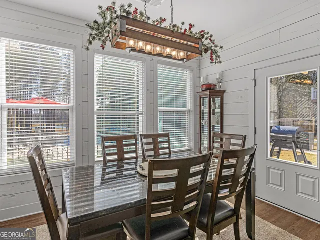 a kitchen with white cabinets stainless steel appliances and sink