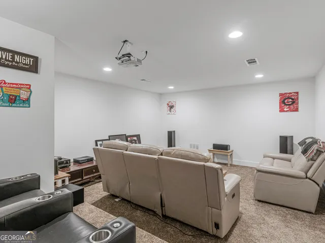 a bathroom with a toilet a sink and a mirror
