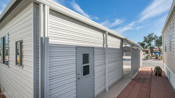 a front view of a building with outdoor seating