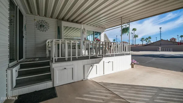a view of a dining tables and chairs in the balcony