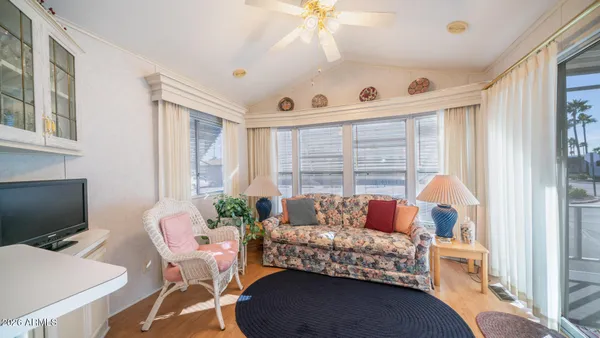 a spacious bathroom with a double vanity sink large mirror and a next to a window