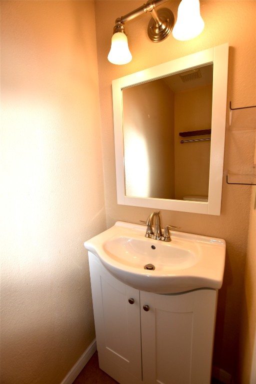 11404 Walnut Ridge Drive, Unit 14 Austin, TX 78753 - Photo 14 of 16 a bathroom with a sink and a mirror