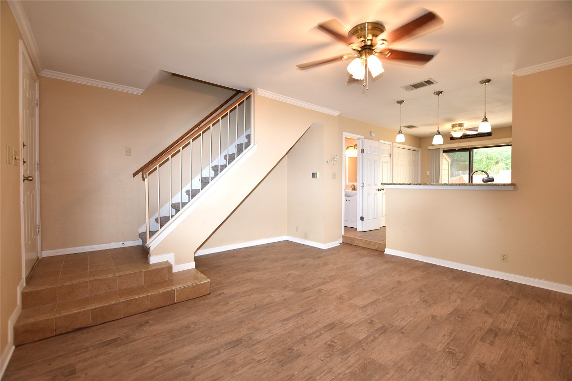 11404 Walnut Ridge Drive, Unit 14 Austin, TX 78753 - Photo 16 of 16 a view of empty room with wooden floor and fan
