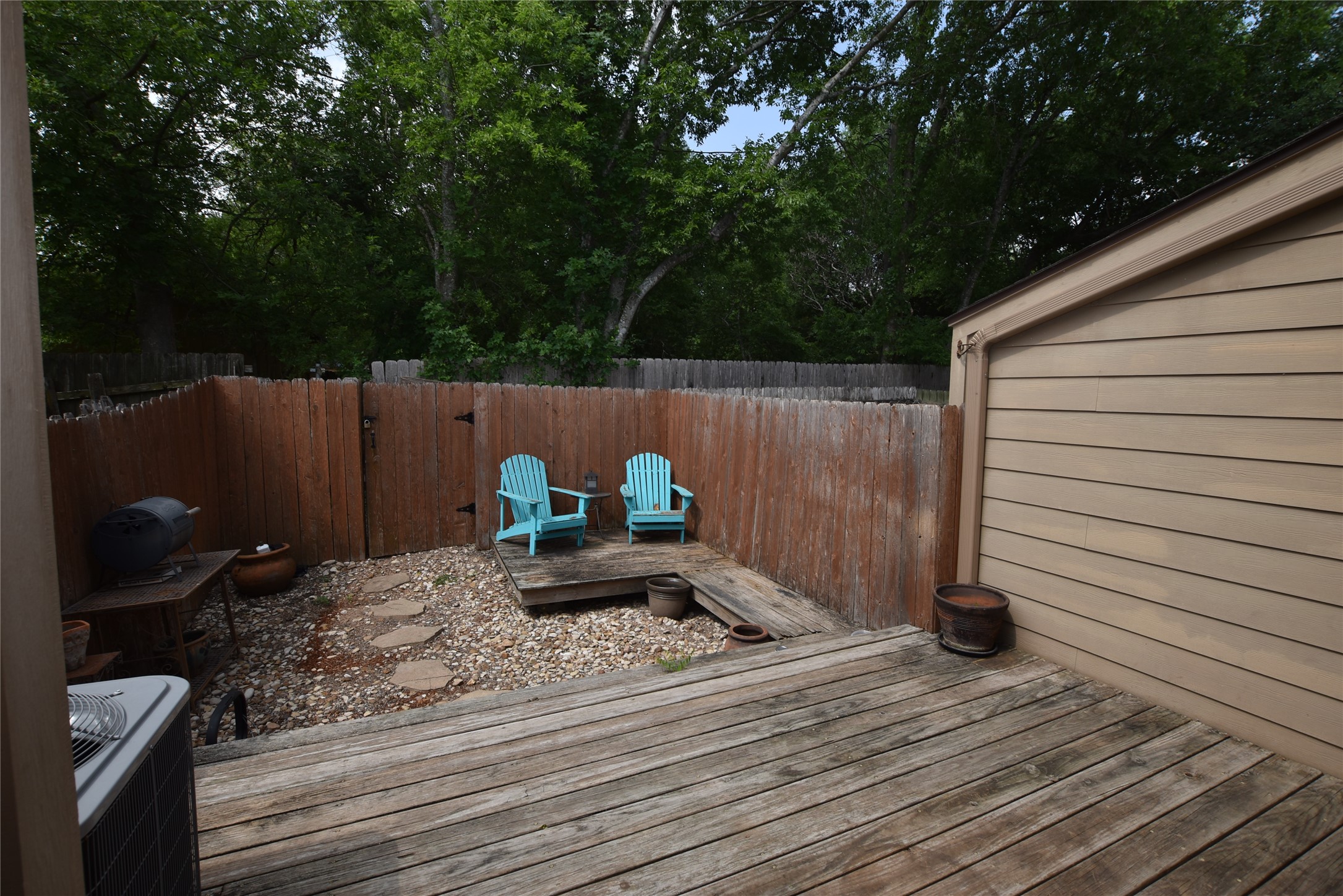 11404 Walnut Ridge Drive, Unit 14 Austin, TX 78753 - Photo 3 of 16 a backyard of a house with lots of green space and outdoor seating