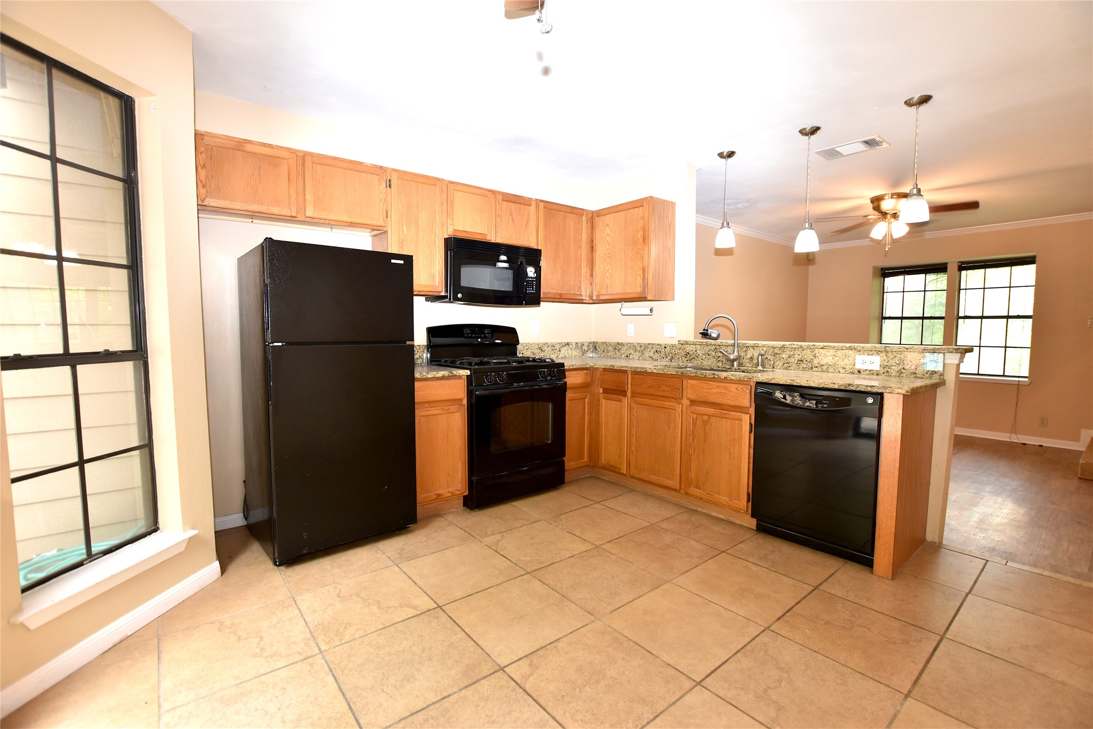 11404 Walnut Ridge Drive, Unit 14 Austin, TX 78753 - Photo 5 of 16 a kitchen with stainless steel appliances granite countertop a refrigerator a stove a sink dishwasher and a refrigerator