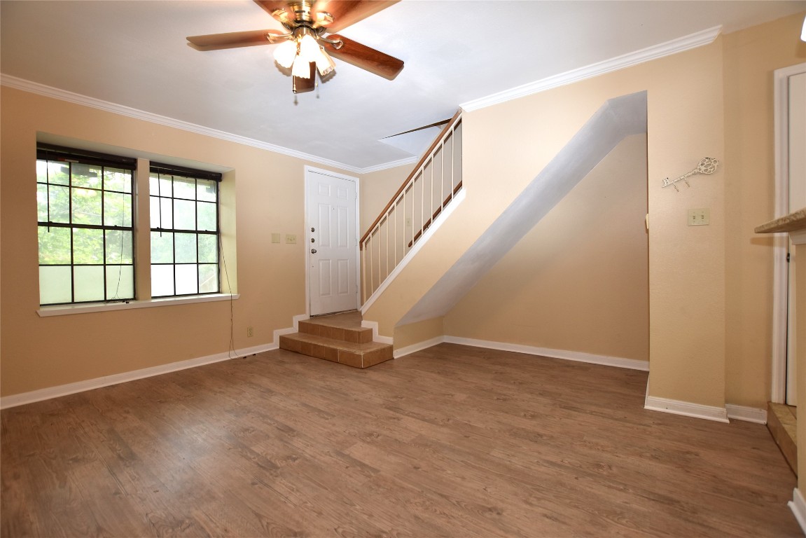 11404 Walnut Ridge Drive, Unit 14 Austin, TX 78753 - Photo 8 of 16 wooden floor in an empty room with a window
