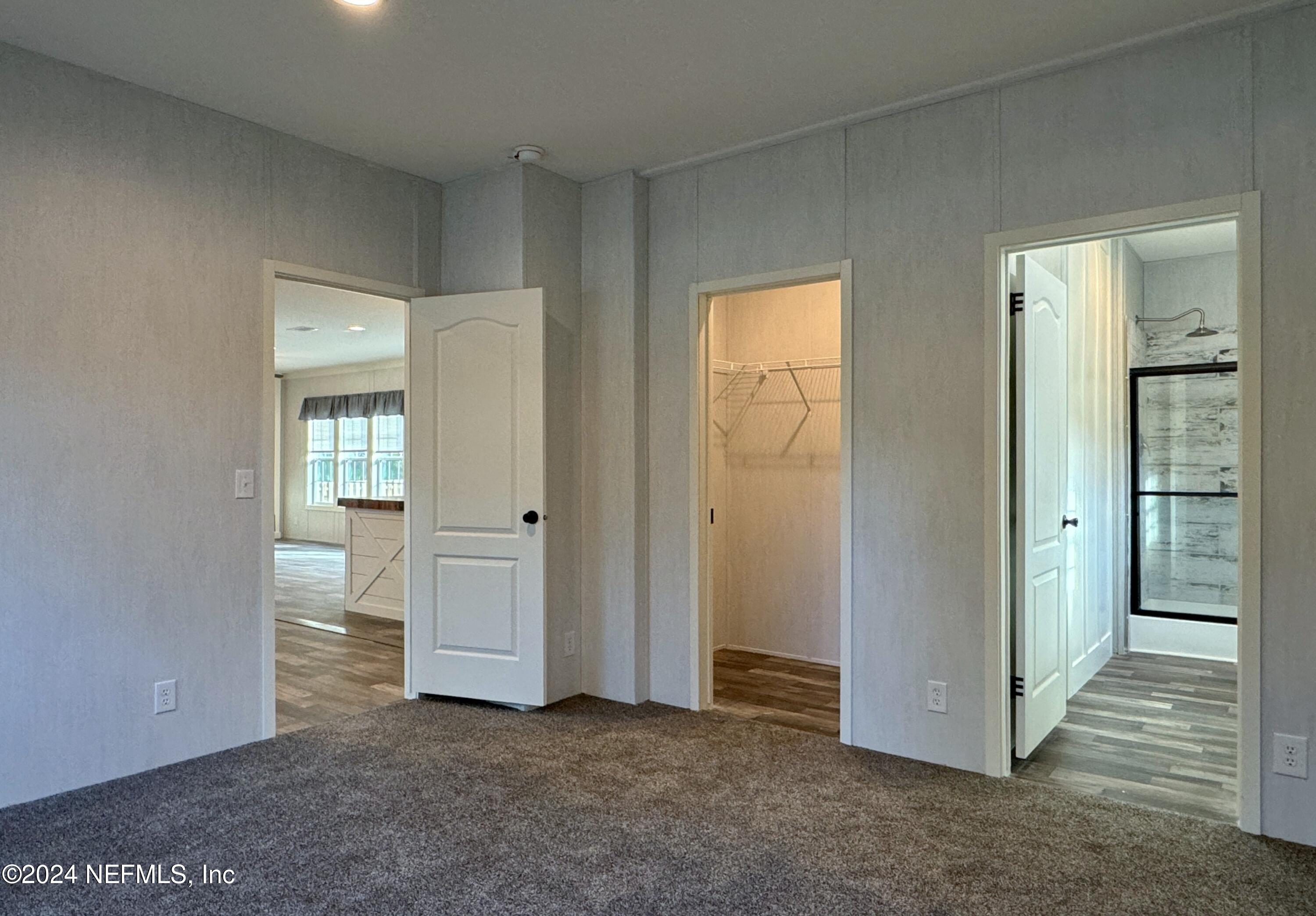 127 Domingo Road Satsuma, FL 32189 - Photo 12 of 18 a view of empty room with wooden floor