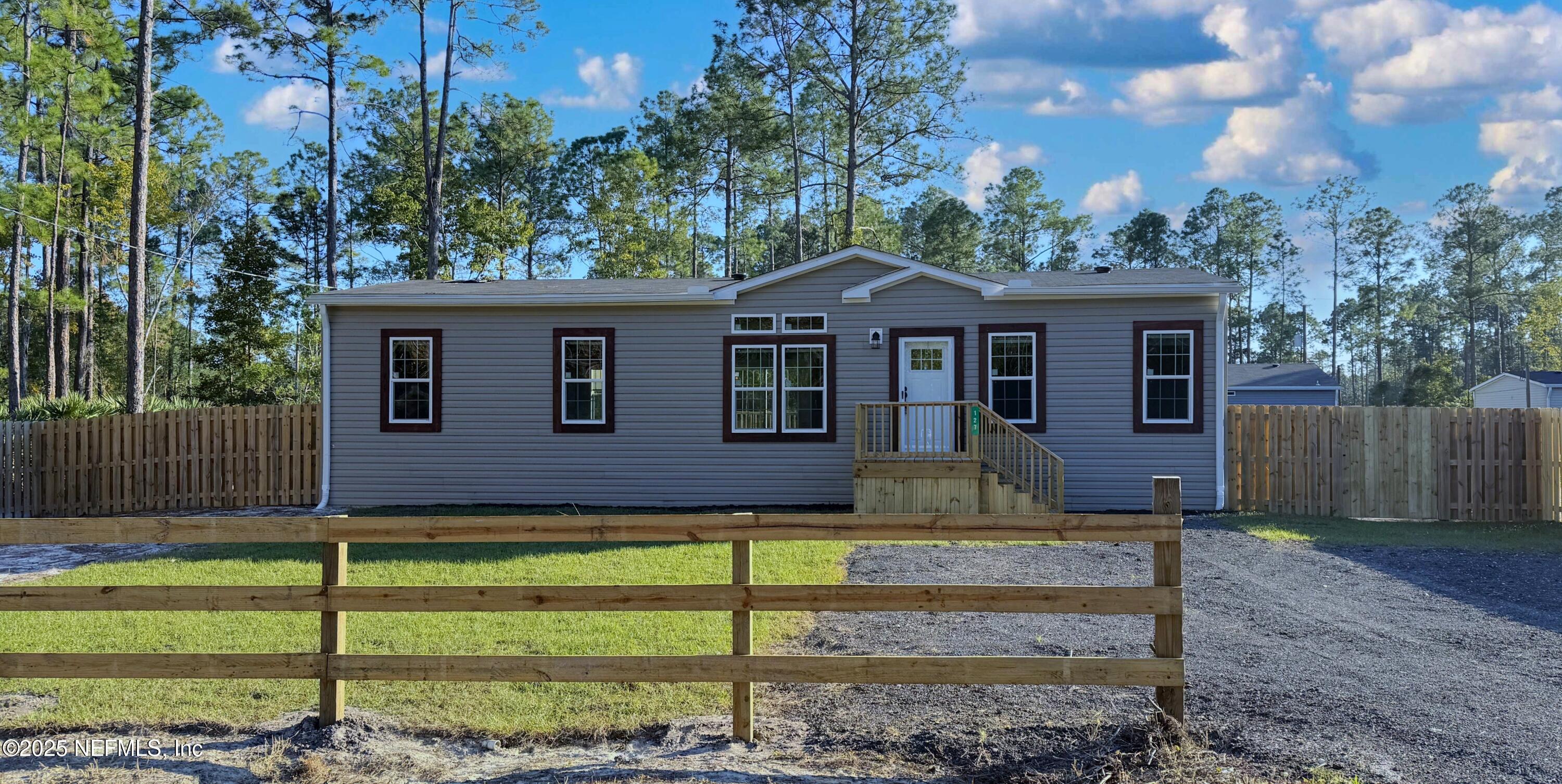 127 Domingo Road Satsuma, FL 32189 - Photo 2 of 18 a front view of a house with a yard