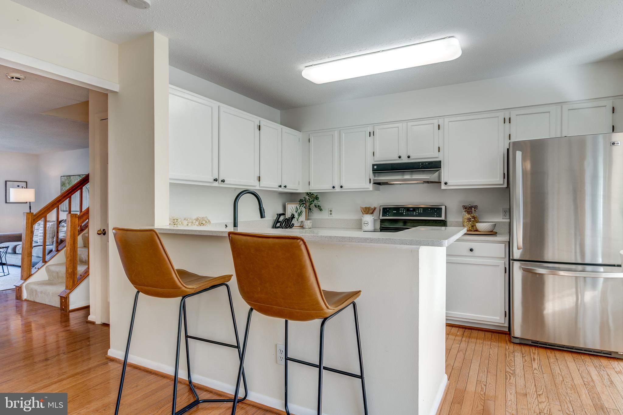 1650 Oak Spring Way Reston, VA 20190 - Photo 13 of 45 SS appliances, Breakfast bar and white shaker cabs