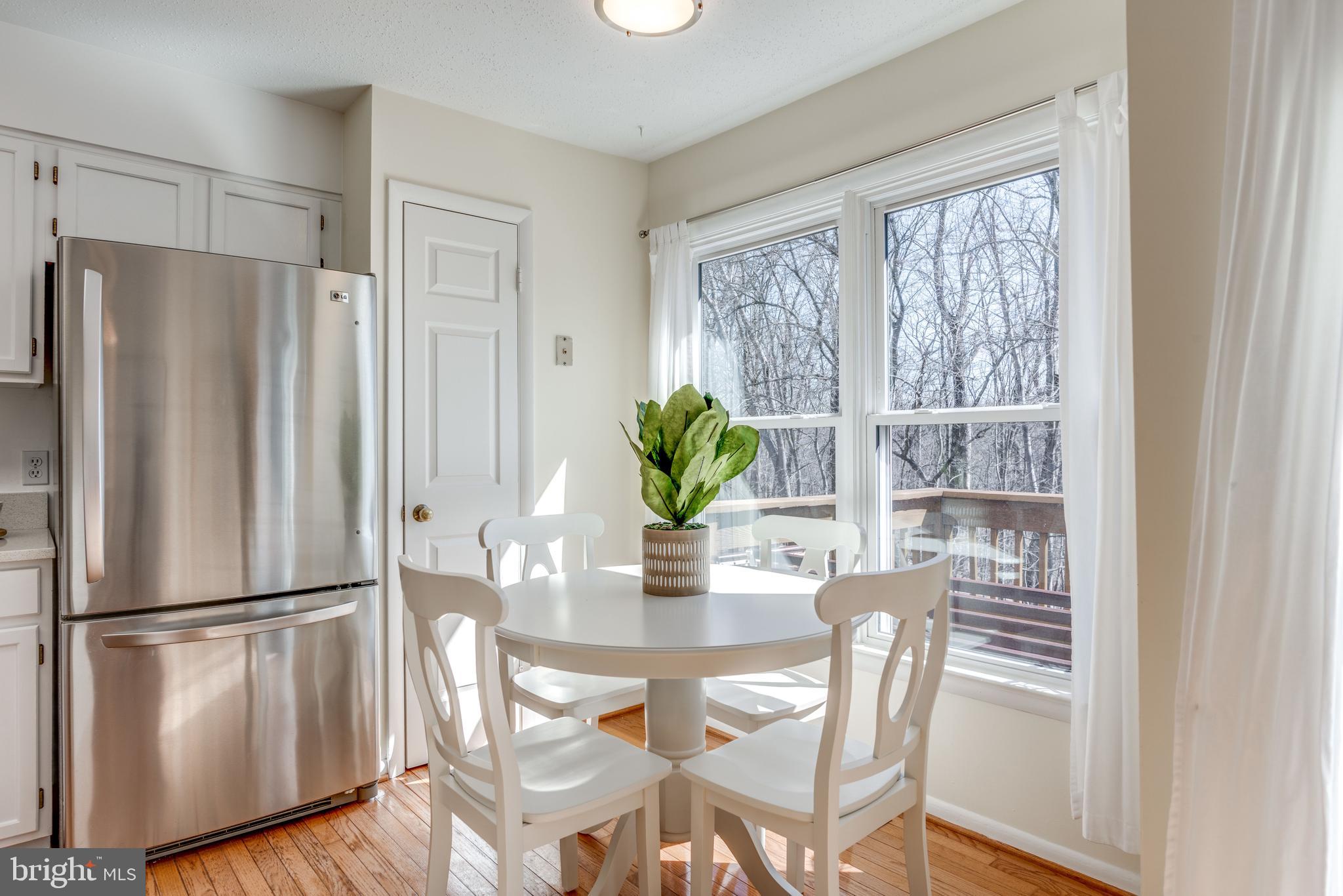 1650 Oak Spring Way Reston, VA 20190 - Photo 14 of 45 Breakfast bar and pantry overlooking tree preserve