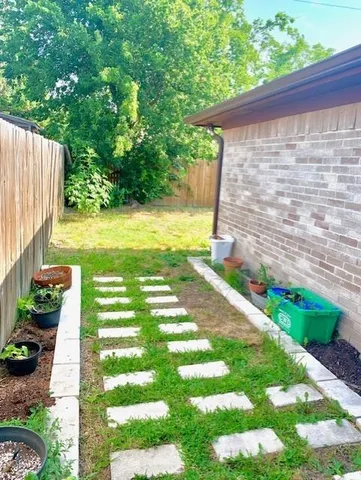 a view of a backyard with sitting area