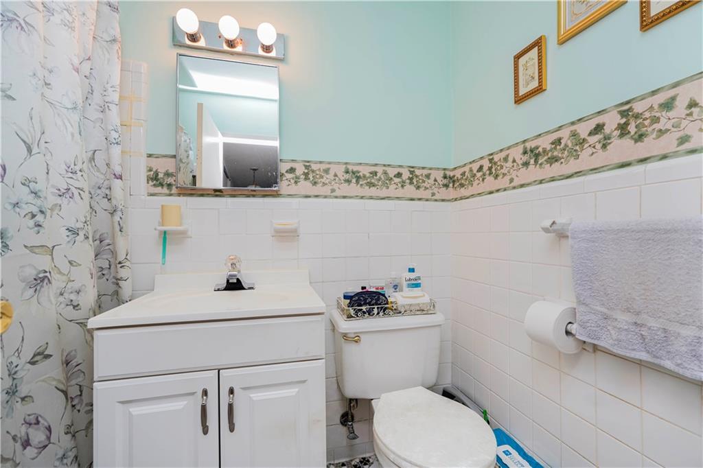 2475 West 16th Street, Unit 4K Brooklyn, NY 11214 - Photo 15 of 15 a bathroom with a sink toilet and mirror