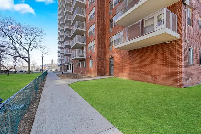 a brick building with a yard