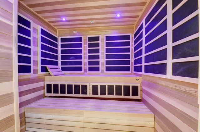 a view of a balcony with wooden floor and a book shelf