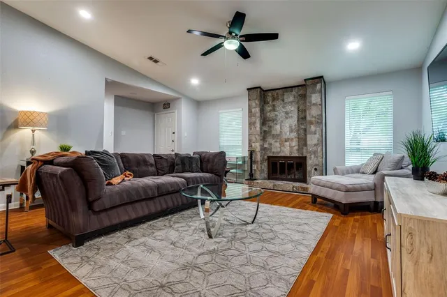 a living room with furniture and a fireplace