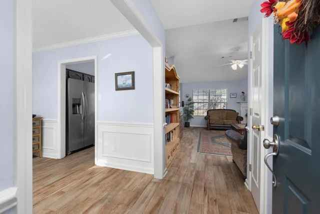 a view of a living room and a wooden floor