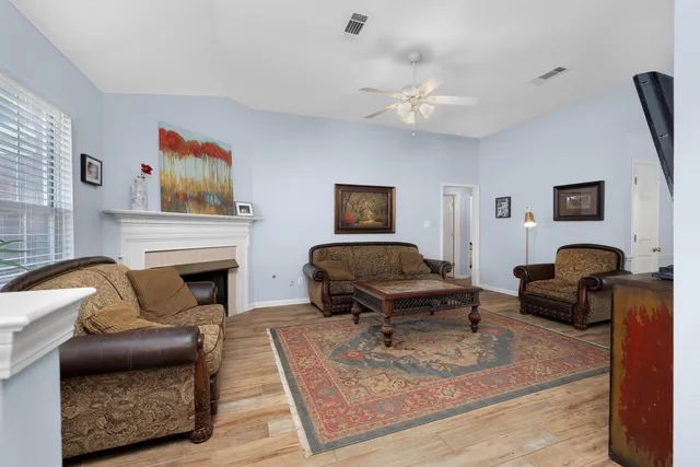 a living room with furniture and a fireplace