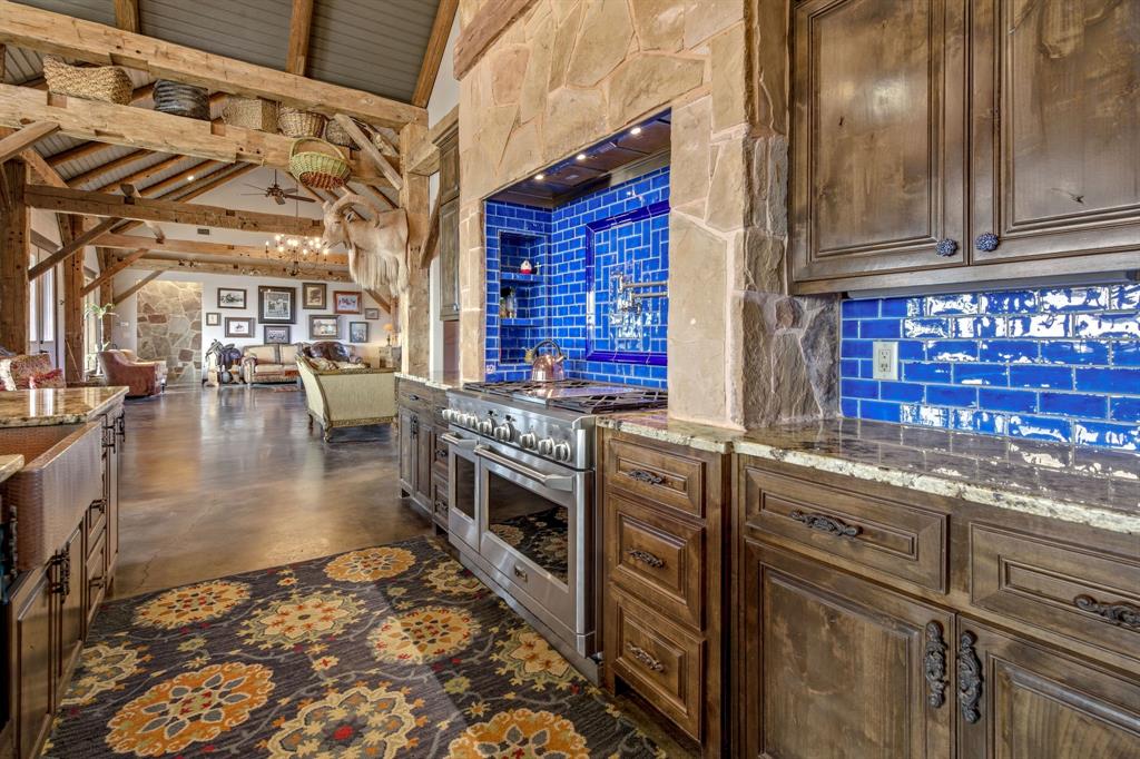650 Fm 2035 Merkel, TX 79536 - Photo 11 of 40 a kitchen with stainless steel appliances granite countertop a stove and cabinets