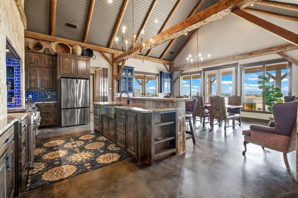 650 Fm 2035 Merkel, TX 79536 - Photo 12 of 40 a kitchen with stainless steel appliances granite countertop a stove and a refrigerator