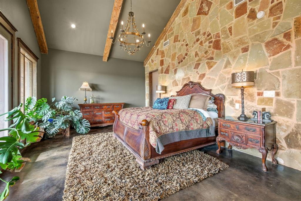 650 Fm 2035 Merkel, TX 79536 - Photo 15 of 40 a bedroom with a bed table flowerpot and window