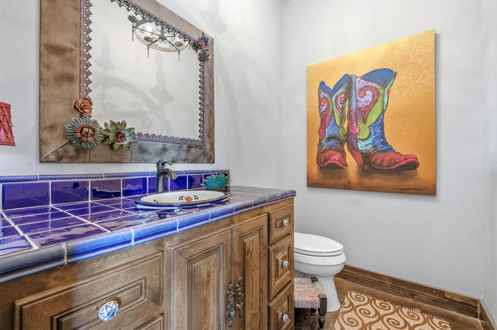 650 Fm 2035 Merkel, TX 79536 - Photo 21 of 40 a bathroom with a toilet sink and mirror