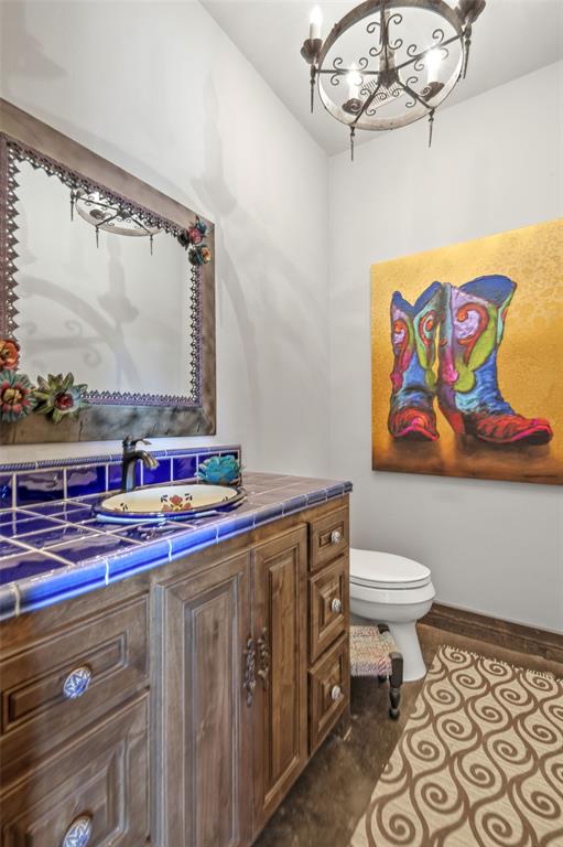 650 Fm 2035 Merkel, TX 79536 - Photo 22 of 40 a bathroom with a toilet a sink and a mirror