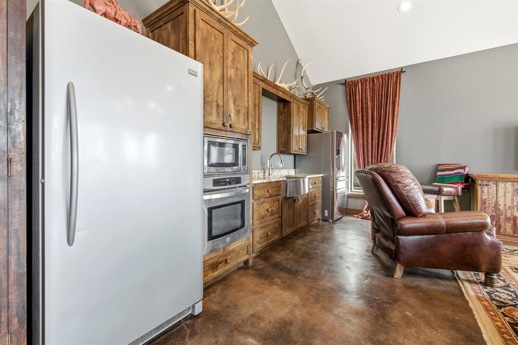 650 Fm 2035 Merkel, TX 79536 - Photo 32 of 40 a kitchen with stainless steel appliances a refrigerator and a furniture