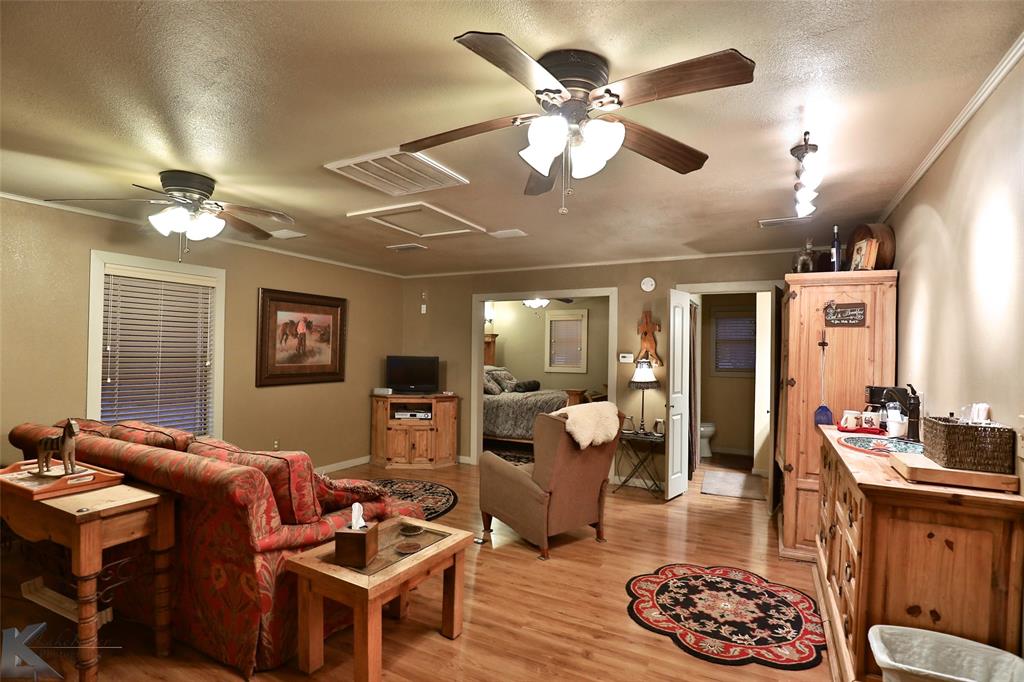 650 Fm 2035 Merkel, TX 79536 - Photo 37 of 40 a living room with furniture a chandelier and a dining room