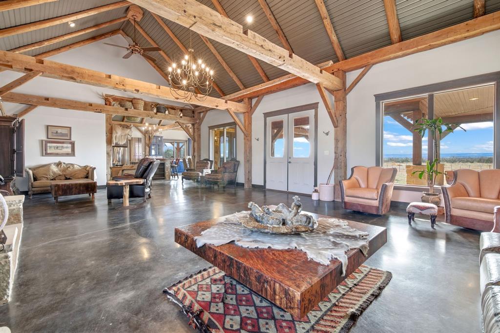 650 Fm 2035 Merkel, TX 79536 - Photo 9 of 40 a living room with furniture a rug and a chandelier