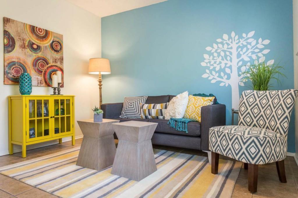 3405 Helms Street, Unit 101 Austin, TX 78705 - Photo 1 of 5 a living room with furniture and a table