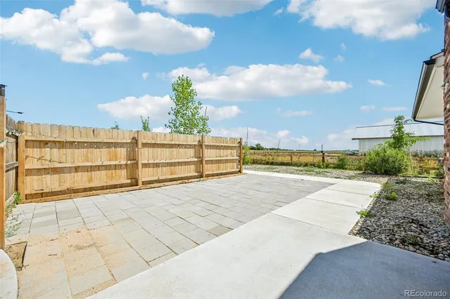 a house view with swimming pool and furniture
