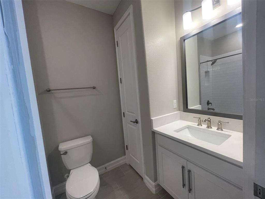 4596 Almada Lane Wesley Chapel, FL 33543 - Photo 11 of 56 a bathroom with a sink toilet and vanity
