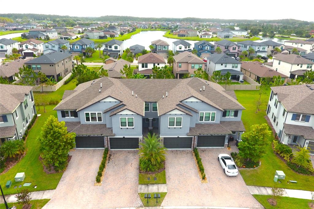 4596 Almada Lane Wesley Chapel, FL 33543 - Photo 21 of 56 an aerial view of residential houses with outdoor space