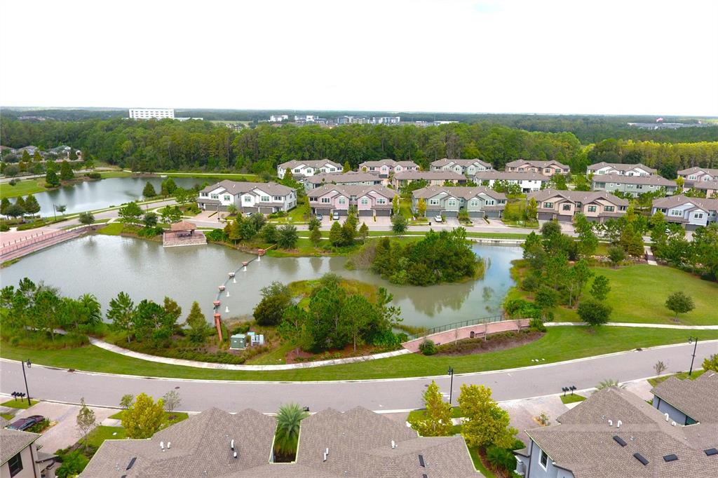 4596 Almada Lane Wesley Chapel, FL 33543 - Photo 25 of 56 an aerial view of residential houses with outdoor space