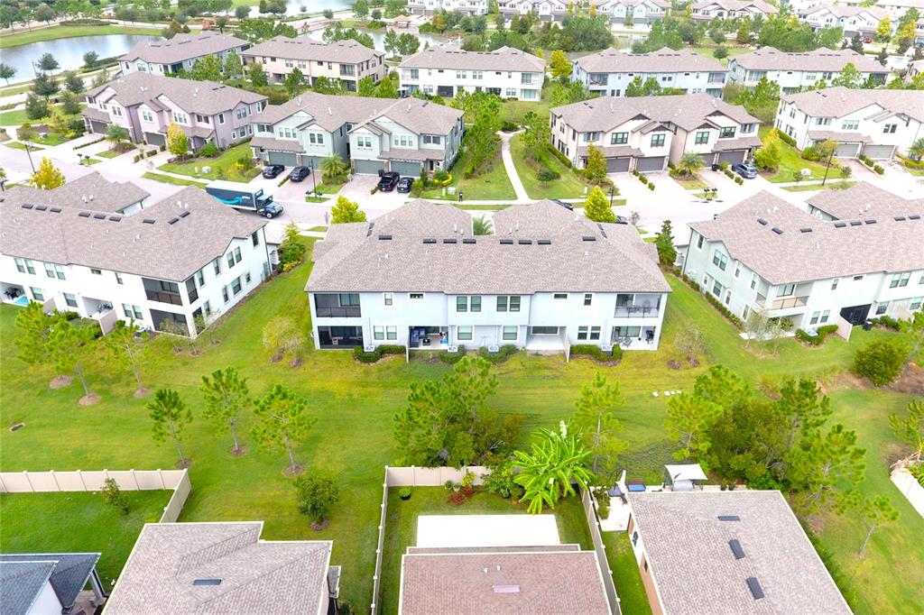 4596 Almada Lane Wesley Chapel, FL 33543 - Photo 28 of 56 an aerial view of residential houses with outdoor space