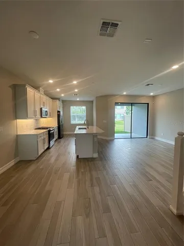 a large living room with a large window