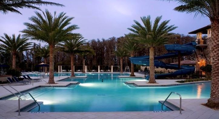 4596 Almada Lane Wesley Chapel, FL 33543 - Photo 37 of 56 a view of a backyard with a patio