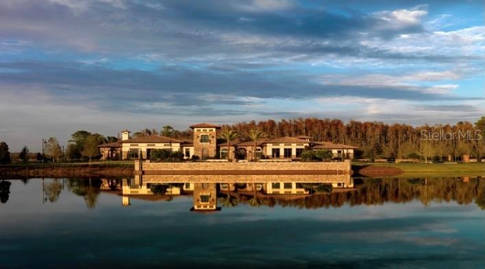 4596 Almada Lane Wesley Chapel, FL 33543 - Photo 41 of 56 a view of water with boats and trees in the background