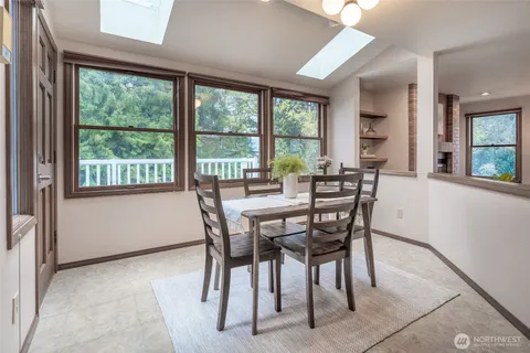 a view of a dining room with furniture and a window