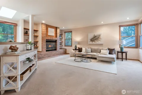 a living room with furniture and fireplace