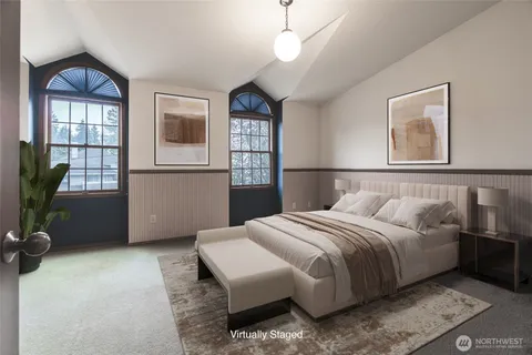 a bedroom with a bed table and window