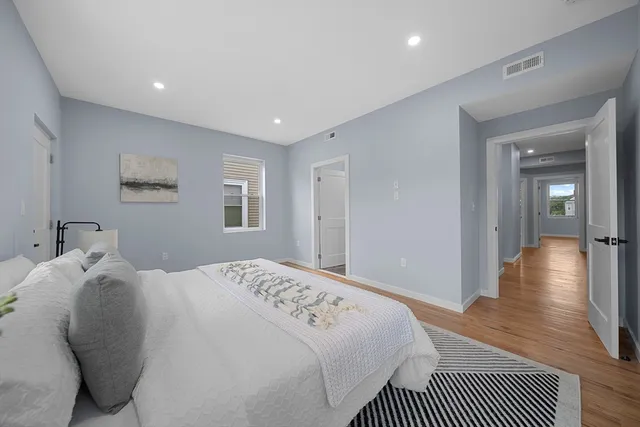 a bathroom with a sink vanity and mirror